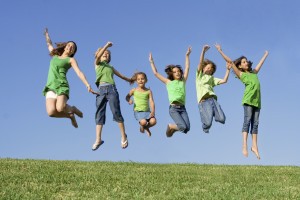 jumping kids in green
