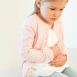 young girl with tummy ache