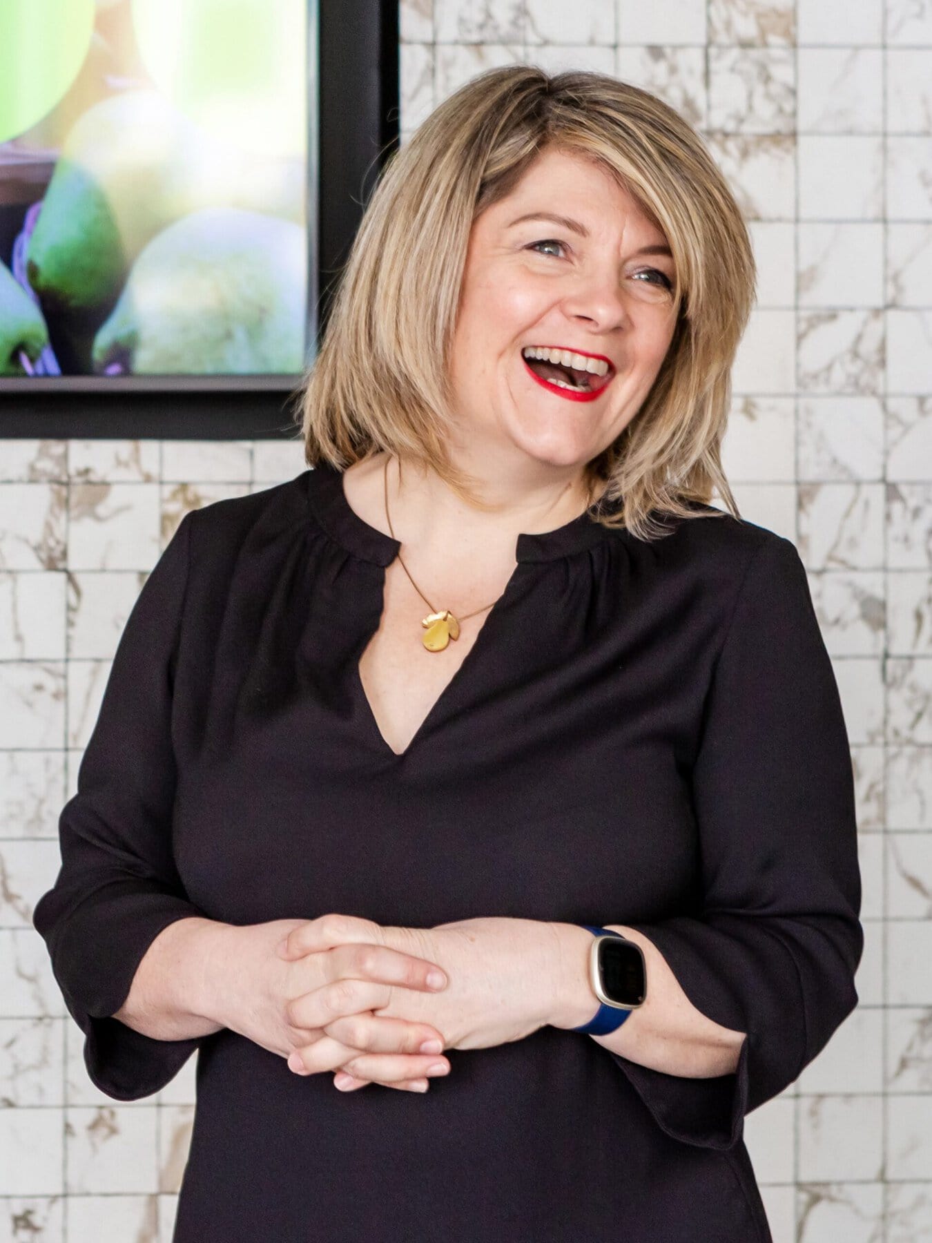 ADHD Coach Emily Fawell laughing whilst presenting featured on the ADHD Coaching fees page of her website
